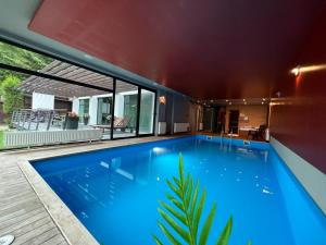 a swimming pool in the middle of a house at Villa Hanan Sarajevo in Sarajevo
