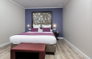 Ein Bett oder Betten in einem Zimmer der Unterkunft Leonardo Boutique Hotel Barcelona Sagrada Familia