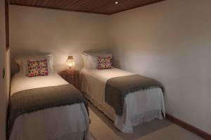 Cama ou camas em um quarto em Embaúba Boutique Hotel