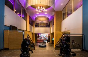 a view of the lobby of a store with purple lighting at NYX Hotel Madrid by Leonardo Hotels in Madrid