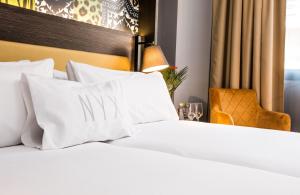 Postel nebo postele na pokoji v ubytování NYX Hotel Madrid by Leonardo Hotels