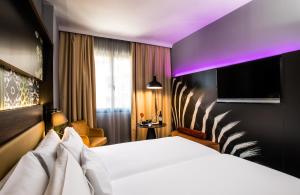 Postel nebo postele na pokoji v ubytování NYX Hotel Madrid by Leonardo Hotels