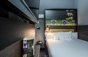 Postel nebo postele na pokoji v ubytování NYX Hotel Madrid by Leonardo Hotels