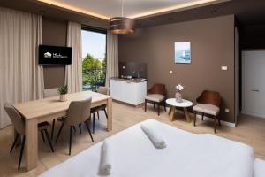 a room with a table and chairs and a dining room at Hill in Požarevac