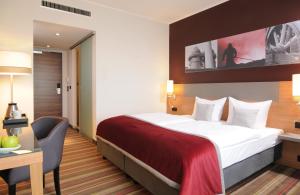 Postel nebo postele na pokoji v ubytování Leonardo Hotel Völklingen-Saarbrücken + 20 fotografií