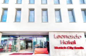 a building with a hotel sign in front of it at Leonardo Hotel Munich City South in Munich