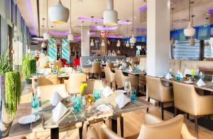 Ein Restaurant oder anderes Speiselokal in der Unterkunft Leonardo Hotel Munich City South 