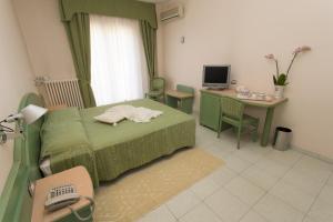 TV a/nebo společenská místnost v ubytování Hotel Grillo