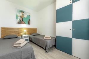Posteľ alebo postele v izbe v ubytovaní Beautiful 2 bedroom apartment Vista del Mar + 31 fotografií