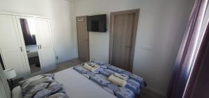 Postel nebo postele na pokoji v ubytování Apartments Ena