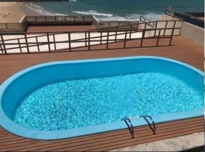 a swimming pool on the deck of a cruise ship at Solar Areia Preta 302 in Natal