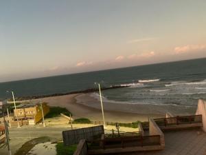 a view of a beach with the ocean at Solar Areia Preta 302 in Natal