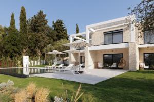 a house with a swimming pool in the yard at Luxurious Villa Trinity in Kontokali