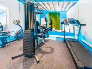a gym with two tread machines and a treadmill at Ocean Sound's Hotel in Hollywood