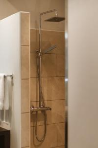 a shower with a shower head in a bathroom at Maitai Bora Bora in Bora Bora