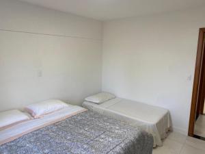 Tempat tidur dalam kamar di Apartamento com piscina Condomínio Balneário Camboriú