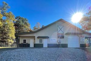 a large white building with a garage at The Barn in Asheville