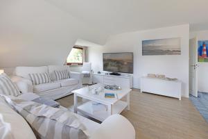 a living room with a couch and a table at Captains Home in List