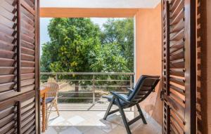 an open door to a balcony with a chair at Apartments and rooms with parking space Fazana - 13742 in Marana