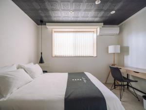 Postel nebo postele na pokoji v ubytování INFINITY HOTEL -jicchaku-