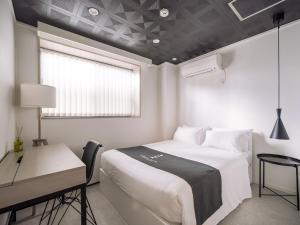 Postel nebo postele na pokoji v ubytování INFINITY HOTEL -jicchaku-