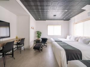 Postel nebo postele na pokoji v ubytování INFINITY HOTEL -jicchaku-