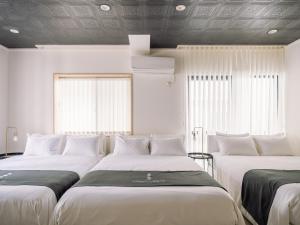 Postel nebo postele na pokoji v ubytování INFINITY HOTEL -jicchaku-