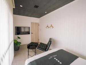 TV a/nebo společenská místnost v ubytování INFINITY HOTEL -jicchaku-