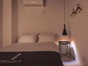 Postel nebo postele na pokoji v ubytování INFINITY HOTEL -jicchaku-