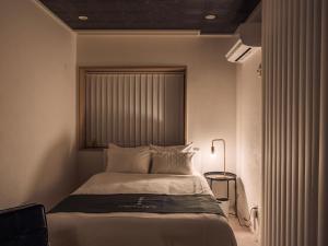 Postel nebo postele na pokoji v ubytování INFINITY HOTEL -jicchaku-
