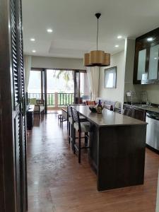a kitchen with a large island in the middle at Paradise in Ko Chang