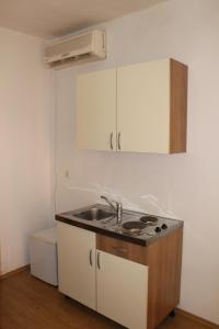 a kitchen with a sink and a counter top at Apartments and rooms with parking space Trilj, Zagora - 14609 in Trilj