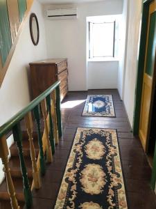 a hallway with a staircase with a rug on the floor at Apartments by the sea Susak, Losinj - 14713 in Susak