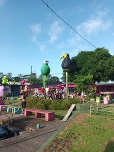 a park with a bunch of inflatable animals at Apartamentos Caimán 3 in Tortuguero