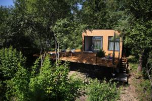 a tiny house on a trailer in the woods at PASSION HUT in Salantai