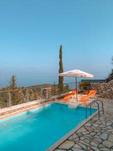 a swimming pool with an umbrella and orange chairs at Lavender House 1 - Agios Nikitas in Agios Nikitas