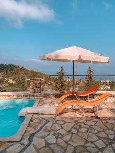 a chair and an umbrella next to a swimming pool at Lavender House 1 - Agios Nikitas in Agios Nikitas