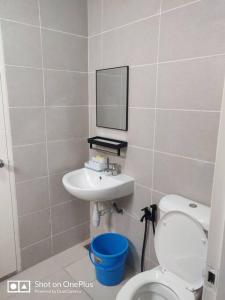 a bathroom with a toilet and a sink at Safiyya Homestay in Kluang