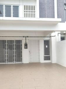 a white house with white doors and windows at Safiyya Homestay in Kluang