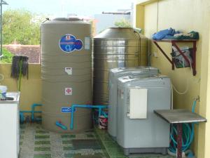 a room with two watermelons and two tanks at 168 Chiangmai Guesthouse in Chiang Mai +15 photos