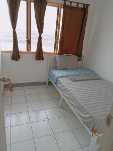 Ένα ή περισσότερα κρεβάτια σε δωμάτιο στο 5บีบี 5BB guest house