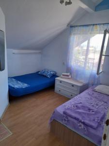 Postel nebo postele na pokoji v ubytování Eleni
