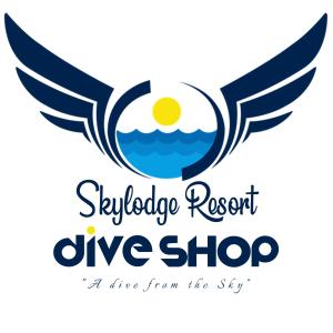 an image of a dive shop logo with wings at Skylodge Resort in Coron