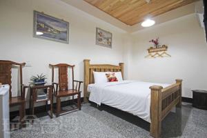 Postel nebo postele na pokoji v ubytování Fish House Homestay