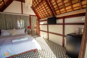 سرير أو أسرّة في غرفة في Sao Biển Cam Ranh - Starfish Cam Ranh