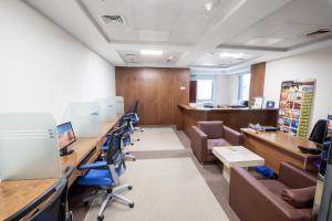 an office with a row of desks and chairs at City Premiere Hotel Apartments - Dubai in Dubai