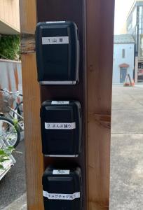 three pieces of luggage stacked on top of each other at Buchoho No Yado Morioka in Morioka +1 photo