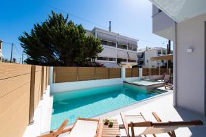 a swimming pool in the backyard of a house at SunilioS Apartments Lefkada in Lefkada