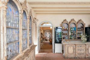 a room with a bar with blue tiles on the walls at Palazzo Novello in Montichiari