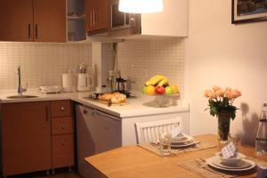 
a kitchen with a white counter top and a white counter top at TownHouse Istanbul in Istanbul
